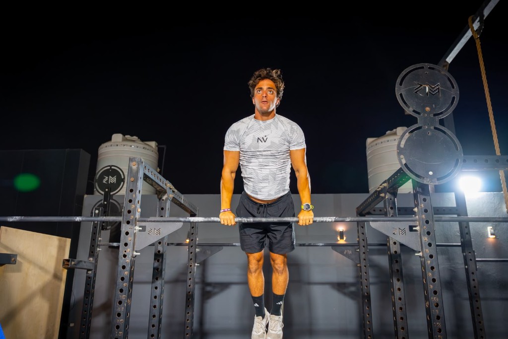 Omar performing a pull-up